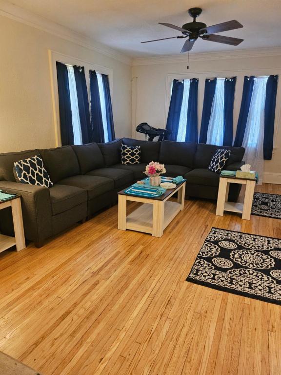 a living room with a couch and a table at Plantlife LLC A in Minneapolis