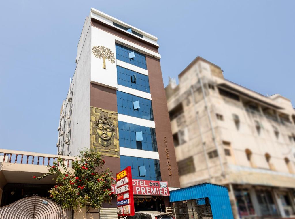 a tall building with a mural on the side of it at Hotel Aditya Premier in Guntūr