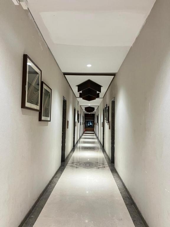 an empty hallway in an office building at DK Club & Resort in Bārdoli