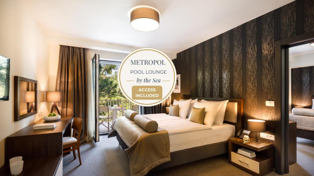 a hotel room with a bed and a desk at Remisens Casa Bel Moretto, depandansa hotela Metropol in Portorož