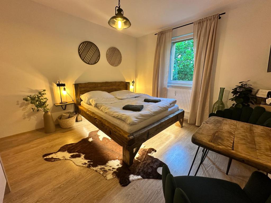 a bedroom with a bed and a dog laying on the floor at Apartmán NIC VÍC in Loučná nad Desnou