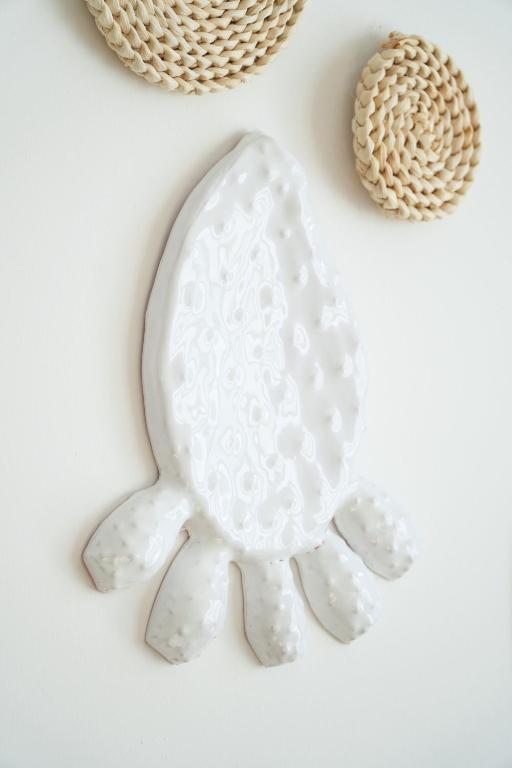a white porcelain turtle cookie jar and other cookies at Leukos Home Relais Ecoretreat b&b in Diamante