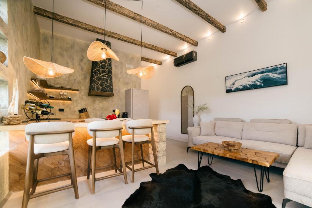 a living room with a couch and a table at Eden's Garden Villa in Ulcinj