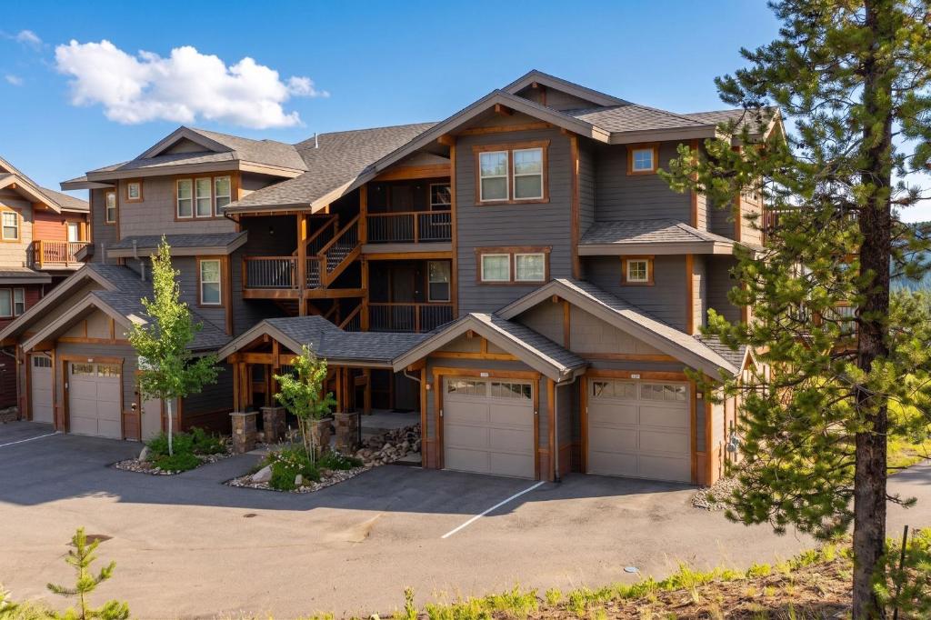a large house with two garage at Cozens Pointe Building G Unit 202 in Fraser