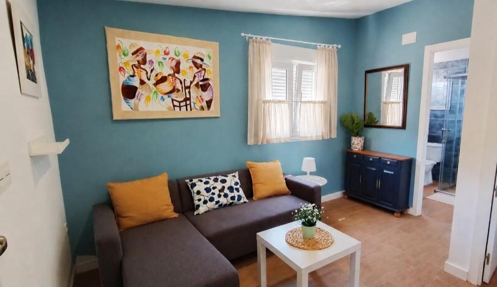a living room with a couch and a table at La Casona de Carcedo 3 in OVD