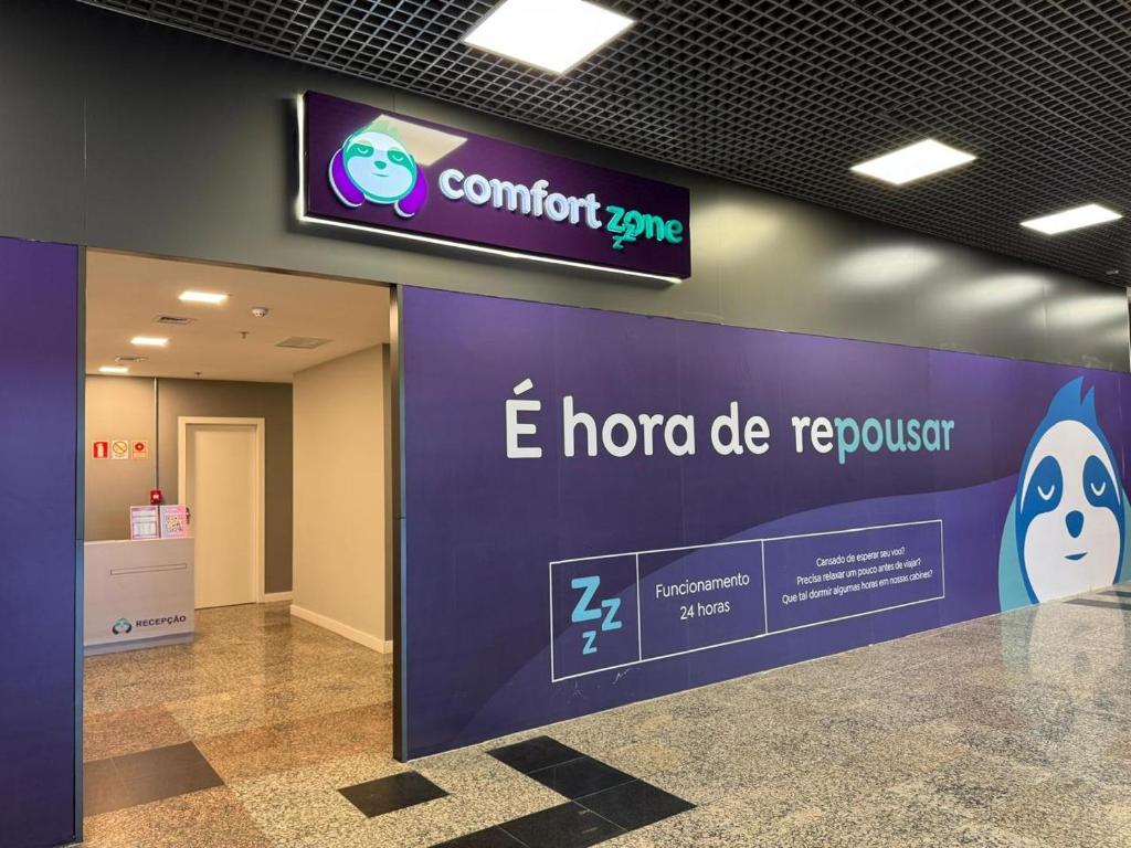 a sign in an airport with a sign for airus hospital at Comfort Zone in Porto Alegre