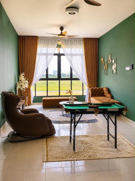 a living room with a couch and a table at klebang Beachfront Homestay I Snooker I Massage Chair I Pool in Malacca