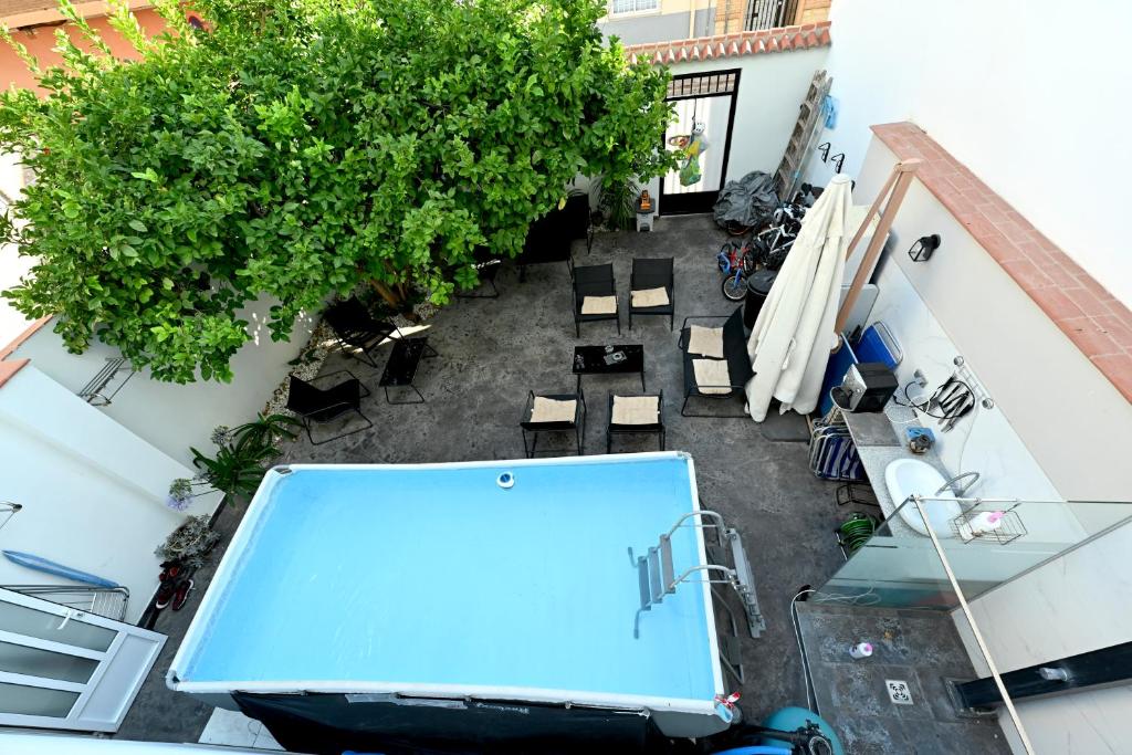 an overhead view of a patio with tables and chairs at LEMON GARDEN Playa in Puerto de Sagunto