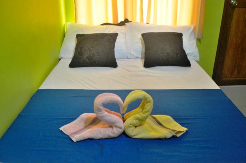 Postel nebo postele na pokoji v ubytování Amelia Homestay