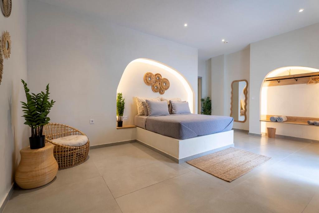 a bedroom with a bed with an arched ceiling at IOSIF hideaway in Neos Marmaras
