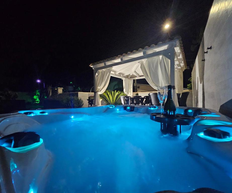 a swimming pool at night with a gazebo at Villa Anny Fronte Mare in Avola
