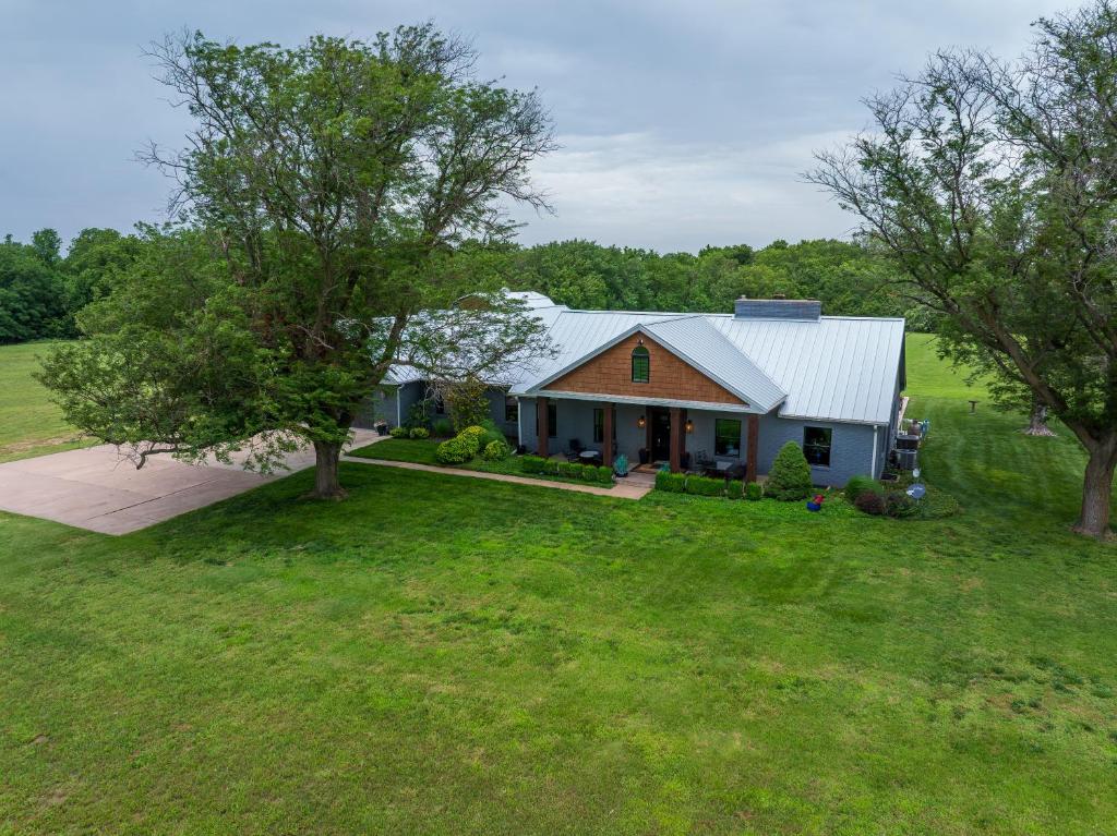 an aerial view of a house with a yard at Whispering Prairie Lodge in Salina