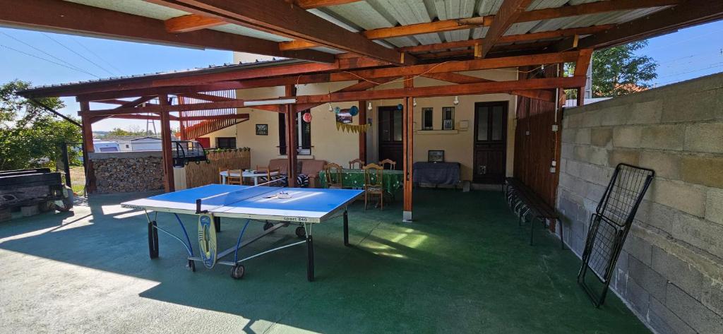 a ping pong table on a patio at AMCP Gîte - Montgiscard in Montgiscard