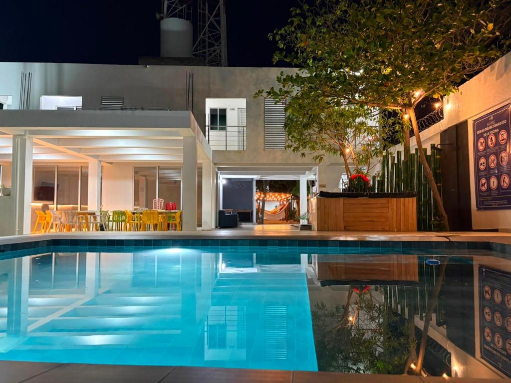 a swimming pool in a house at night at Hotel y Piscina Villa Maria Uribia in Uribia