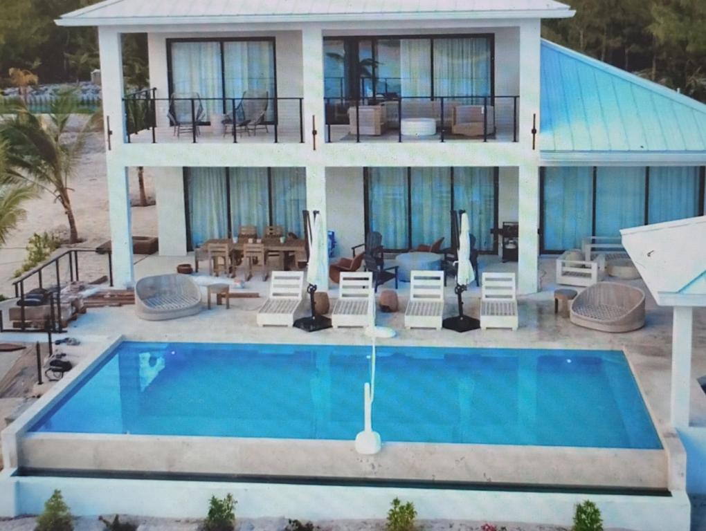an aerial view of a house with a swimming pool at Pestica Villa Private Pool in Leeward