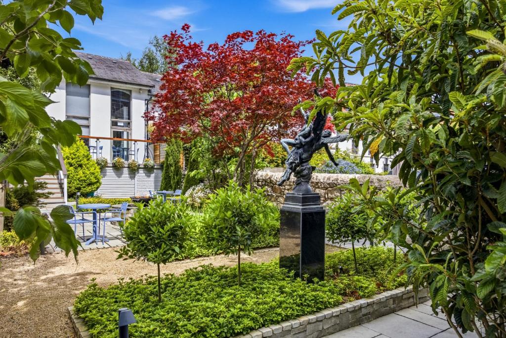 a statue in a garden in front of a house at Number 31 in Dublin