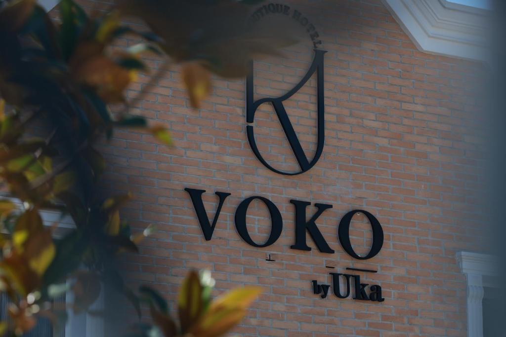 a brick wall with a yoda sign on it at Voko by Uka Boutique Hotel in Tirana