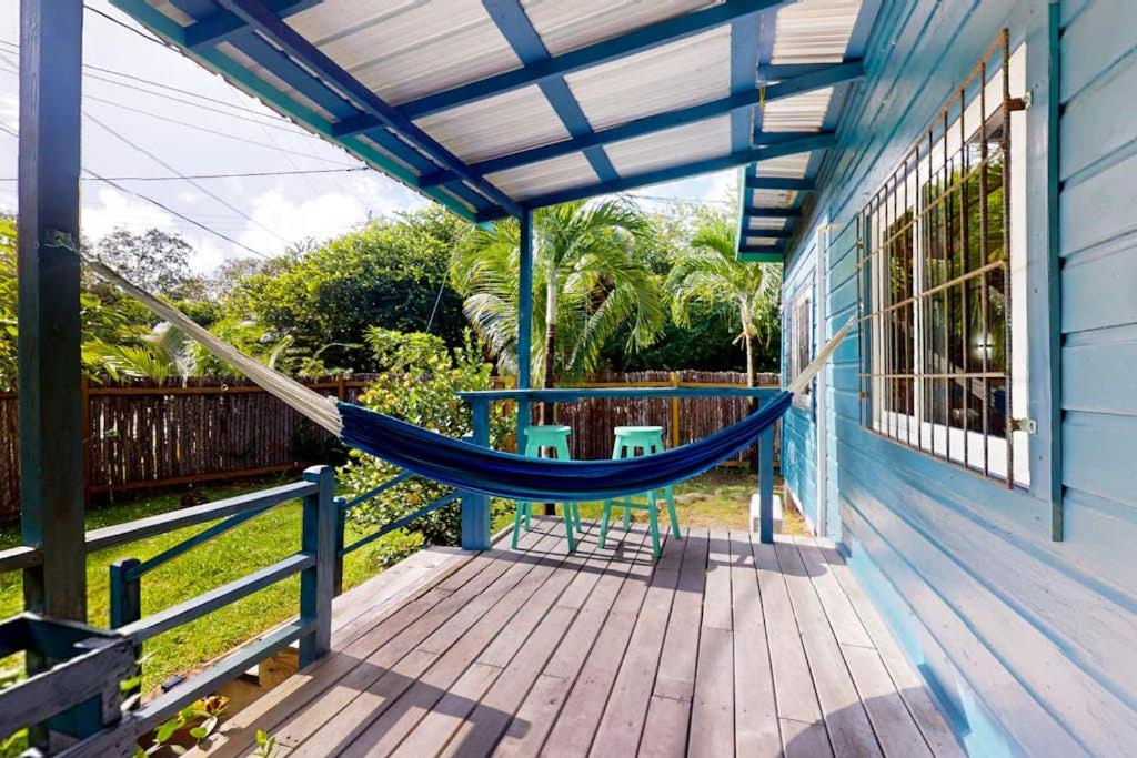 a hammock on the porch of a house at Casita in Placencia