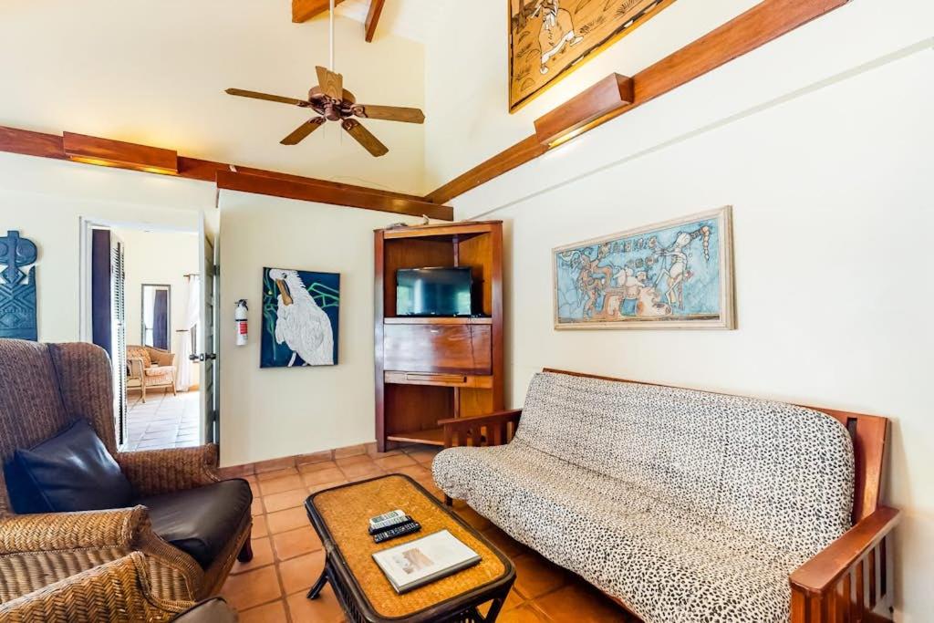 a living room with a couch and a table at Condo #26 @ Beachside Villas in Placencia