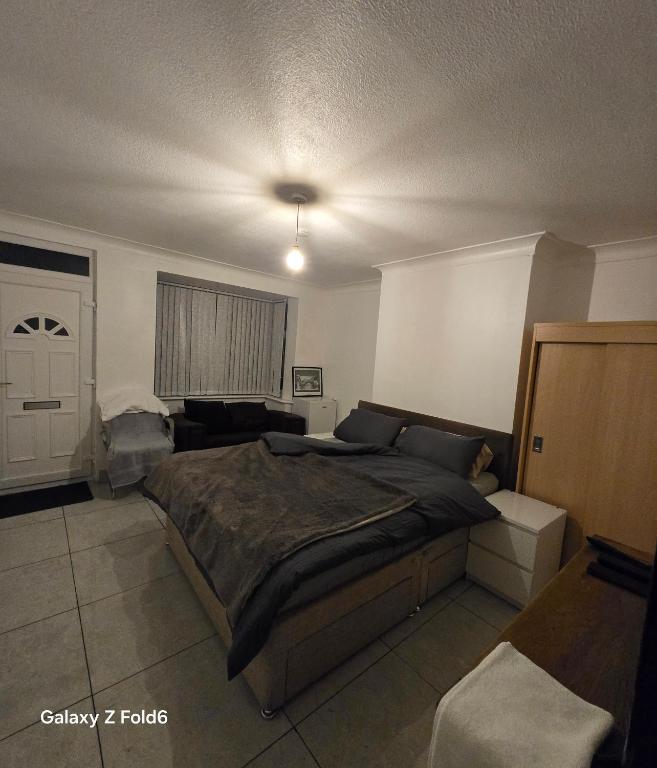 a bedroom with a large bed in a room at Nowell walk in Leeds
