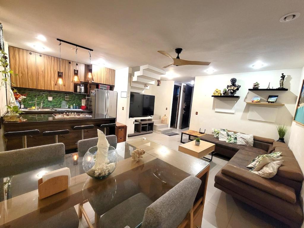 a living room with a couch and a table at Home La Reina in Guadalajara