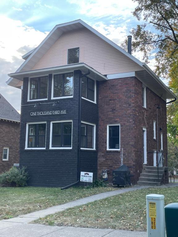a house with a sign on the front of it at Esplanade at Clear Lake in Waseca