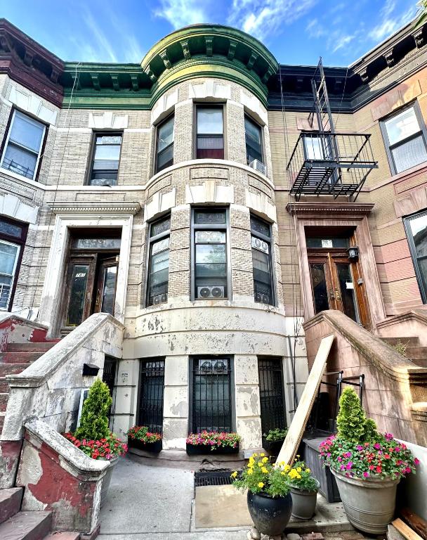a building with potted plants in front of it at the Brooklyn Riviera in Brooklyn