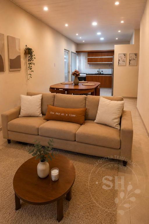 a living room with a couch and a table at SHINY House 2 habitaciones in Clorinda