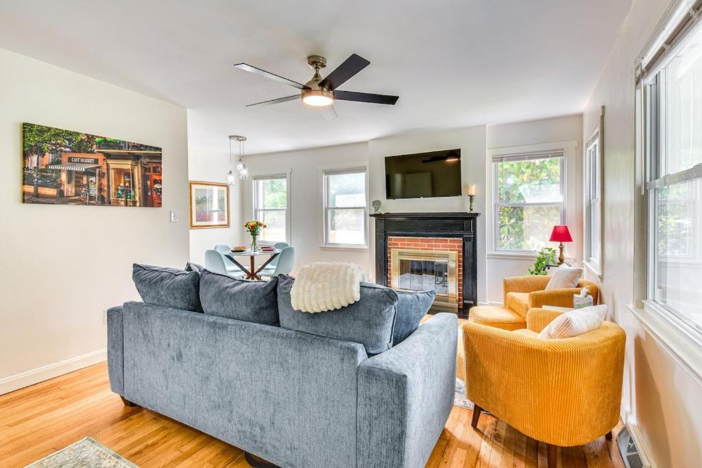 a living room with a couch and a fireplace at The Cottage on Corinth in Seneca