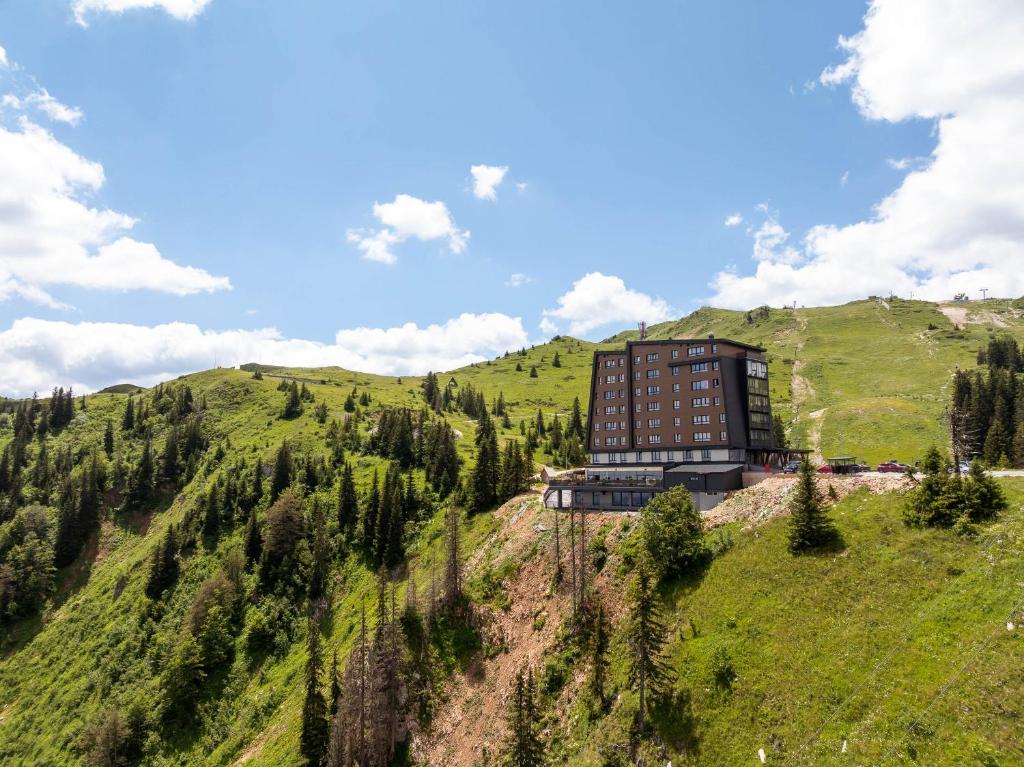 a building on the side of a mountain at Horizont Aparthotel Jahorina in Jahorina