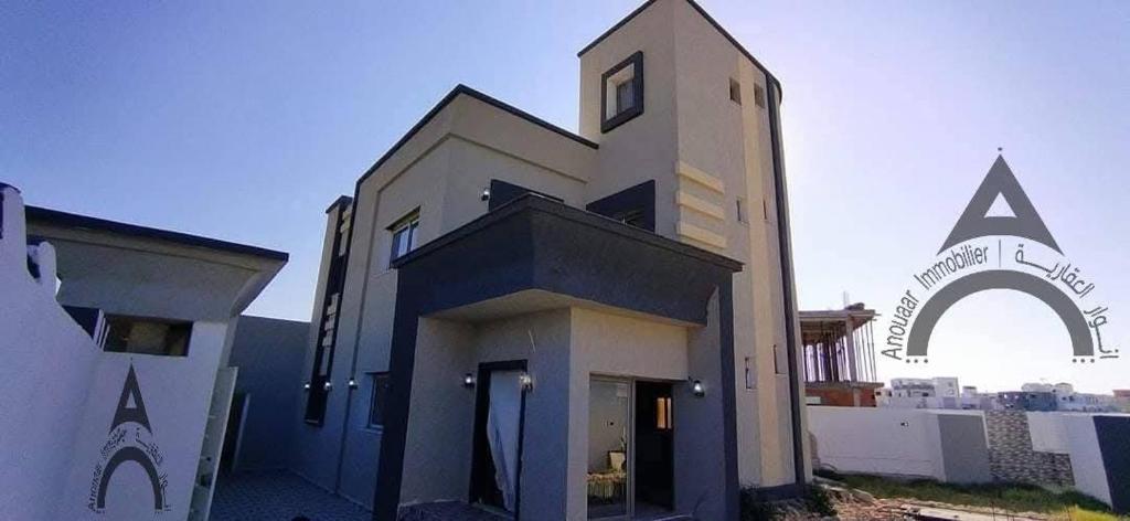 a large building with at Maison mazar in Bin Fatāʼil