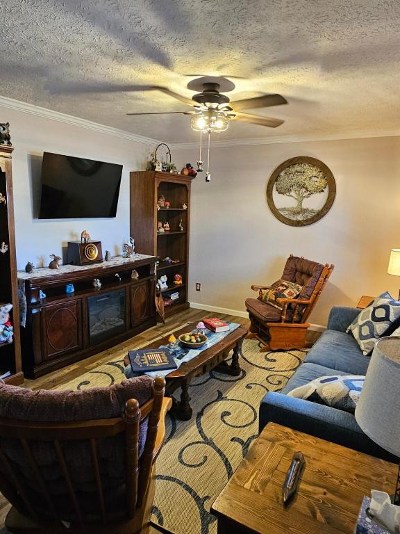 a living room with a couch and a table at Rowan's Mountain View in Powell