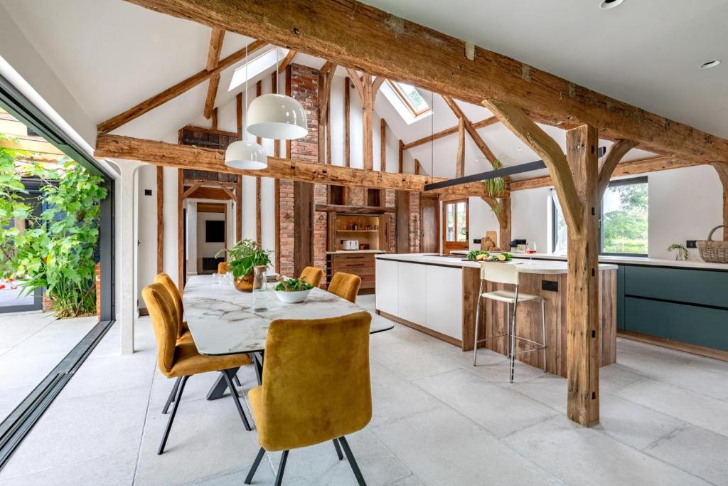 a kitchen and dining room with a table and chairs at 3 Bed in Ditchingham oc-s42751 in Ditchingham