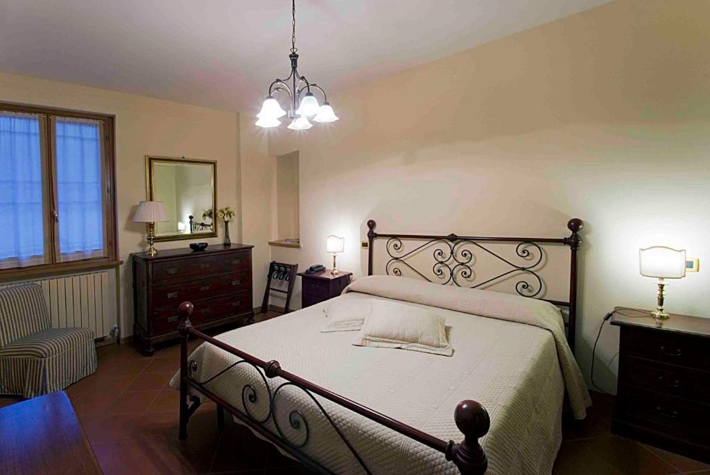Postel nebo postele na pokoji v ubytování Albergo Villa Cristina