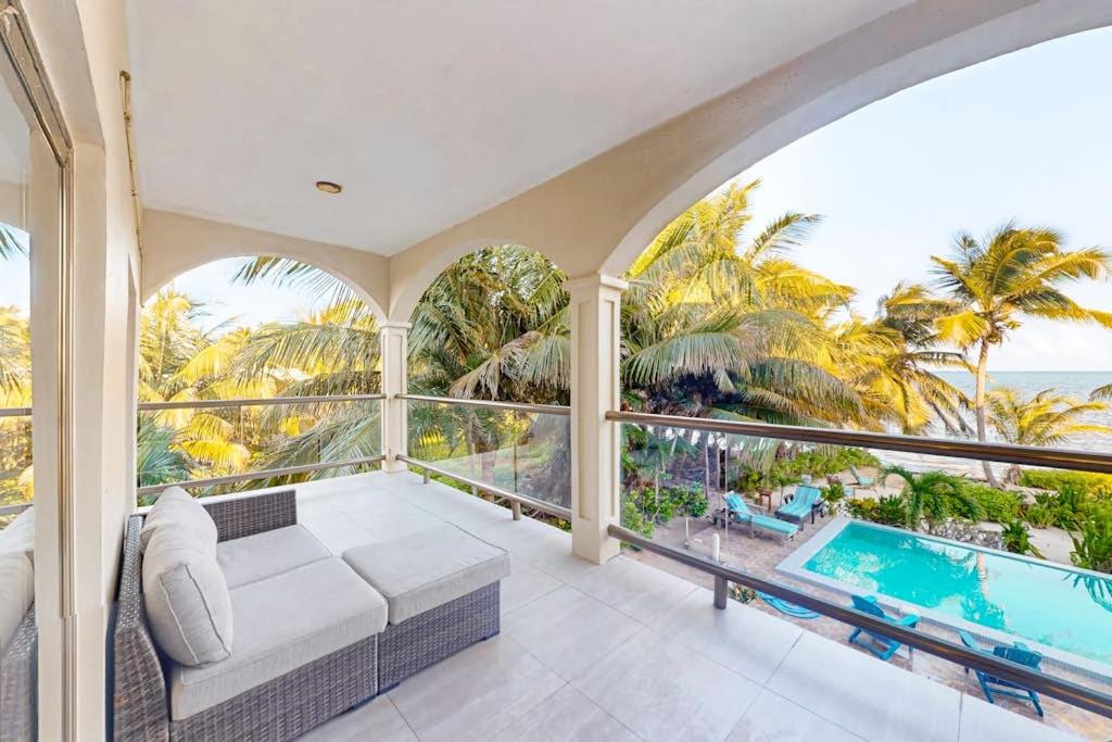 an indoor balcony with a couch and a view of the ocean at Relaxing condo with shared pool ocean views partial AC & WiFi in San Pedro