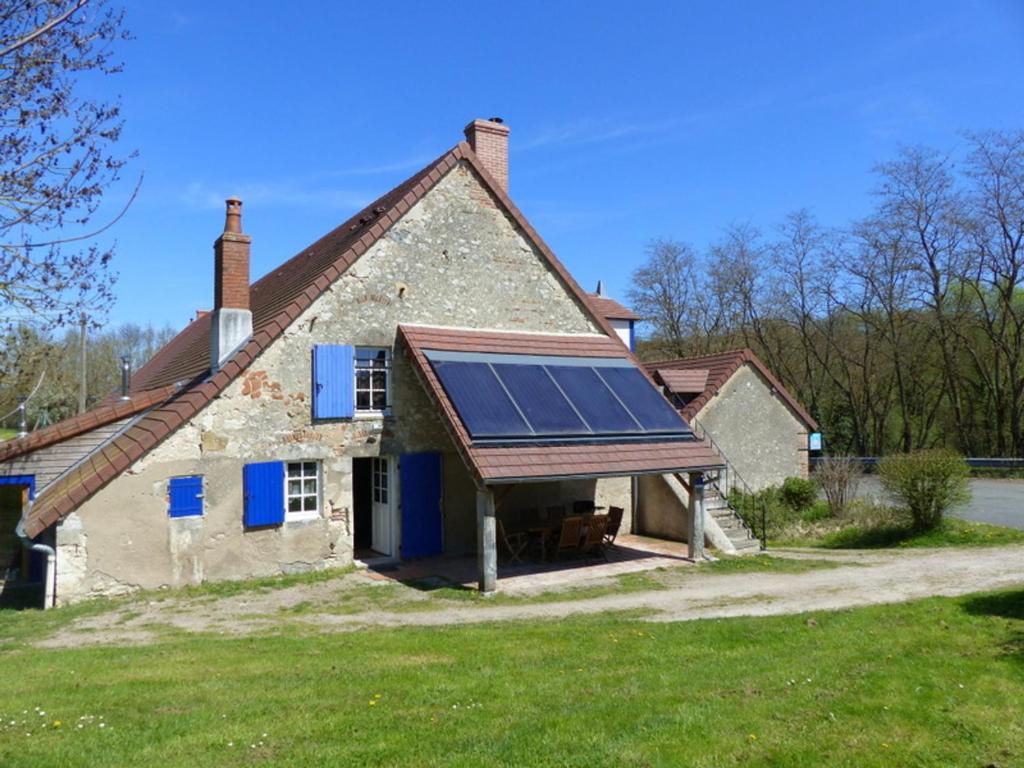 a house with a solar panel on the front of it at Éco-gîte rénové avec wifi près de Vichy - FR-1-489-290 in Bransat