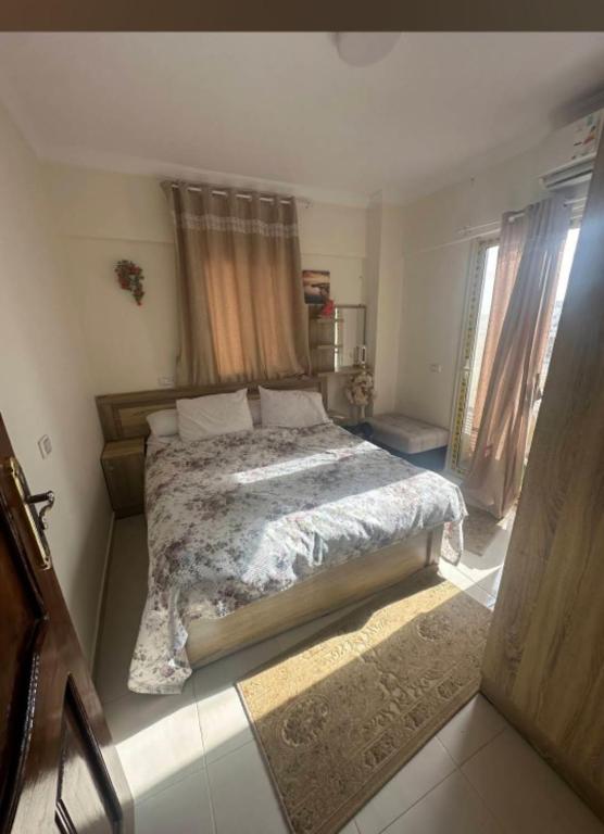 a bedroom with a large bed in a room at Asala Village, Blue Bay Resort, Marsa Matrouh in Marsa Matruh