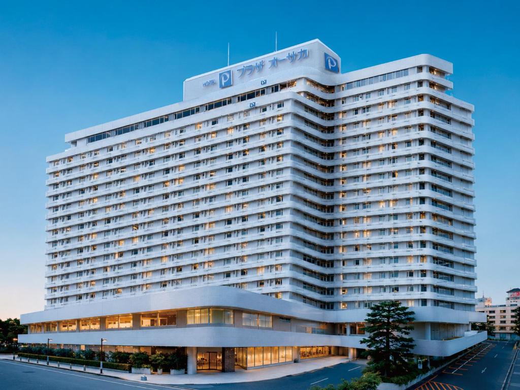 a large white building with a lot of windows at Hotel Plaza Osaka in Osaka