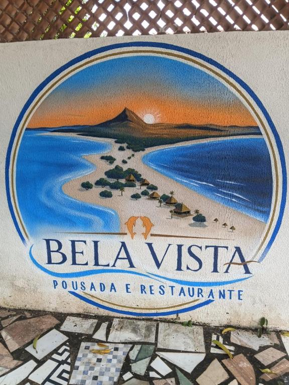 a sign for a resort with a picture of a beach at Bela Vista Pousada Alter in Alter do Chao
