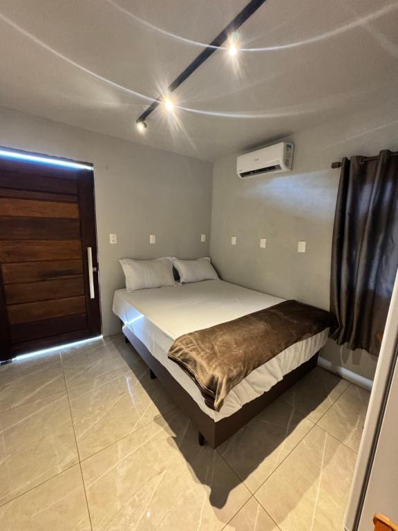 a bedroom with a bed in a room at Pousada Bonetti Quarto 11 in Santa Rosa