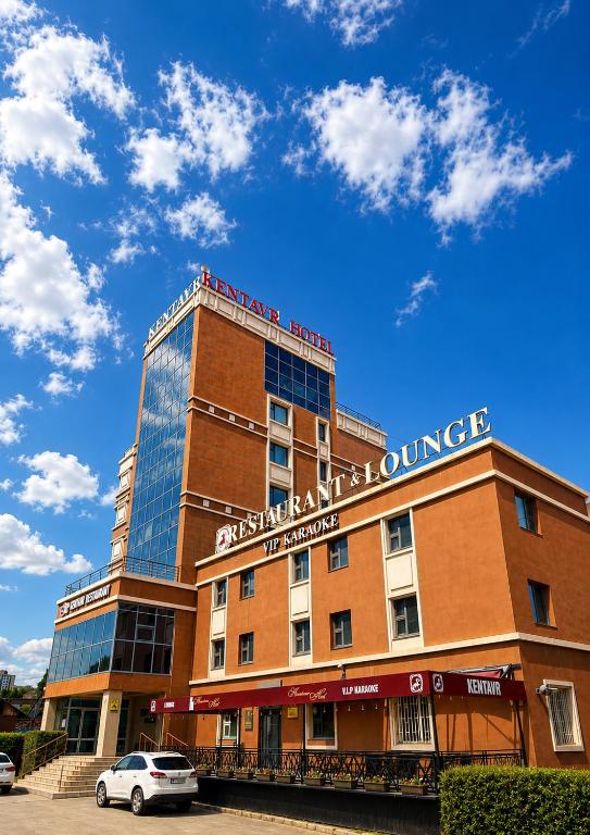 a building with a sign on top of it at Kentavr Hotel in Ulaanbaatar