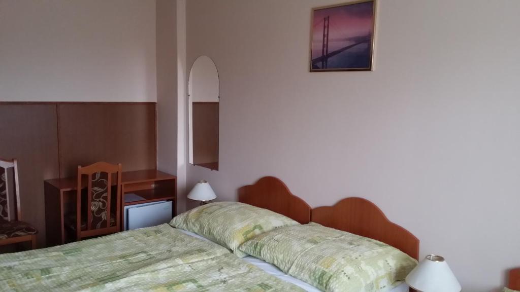 Postel nebo postele na pokoji v ubytování Stop Panzio