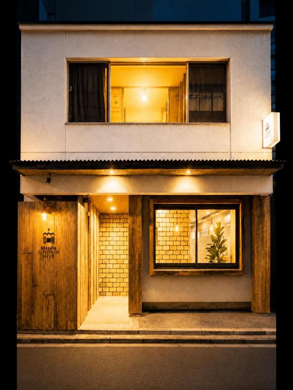 a house with lights on the side of it at Akasaka Guesthouse HIVE in Tokyo