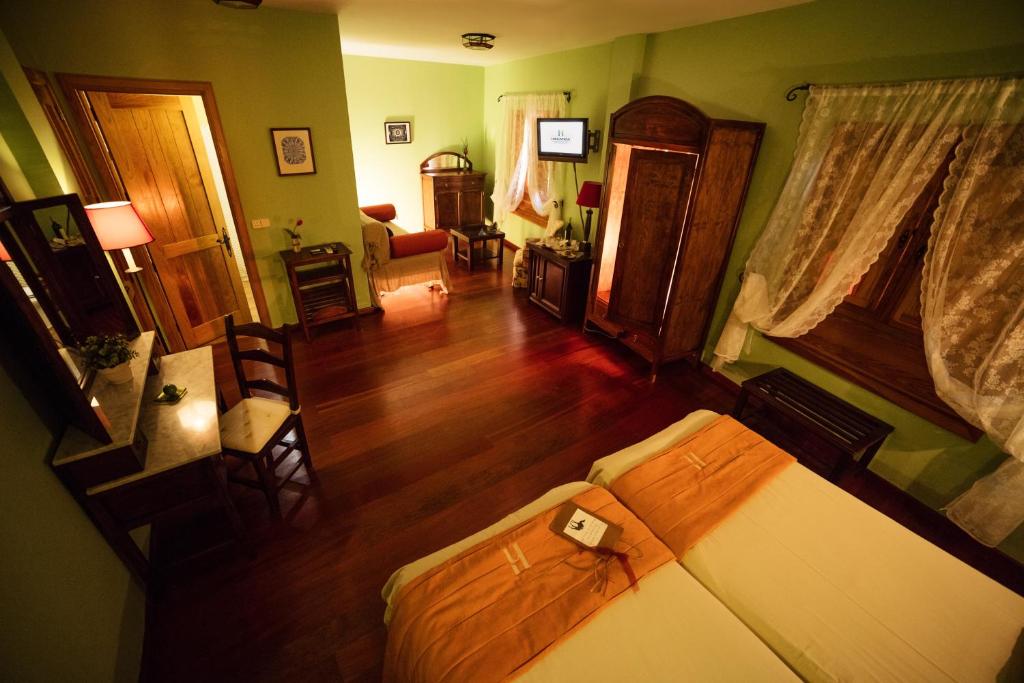Posteľ alebo postele v izbe v ubytovaní Hotel Rural Casa de Los Camellos