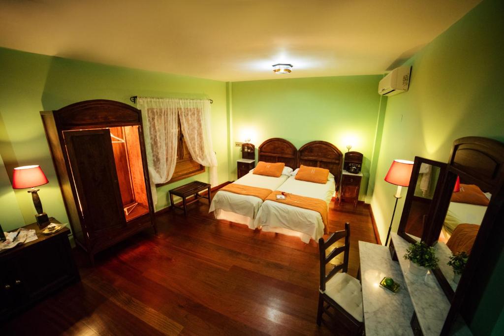Posteľ alebo postele v izbe v ubytovaní Hotel Rural Casa de Los Camellos