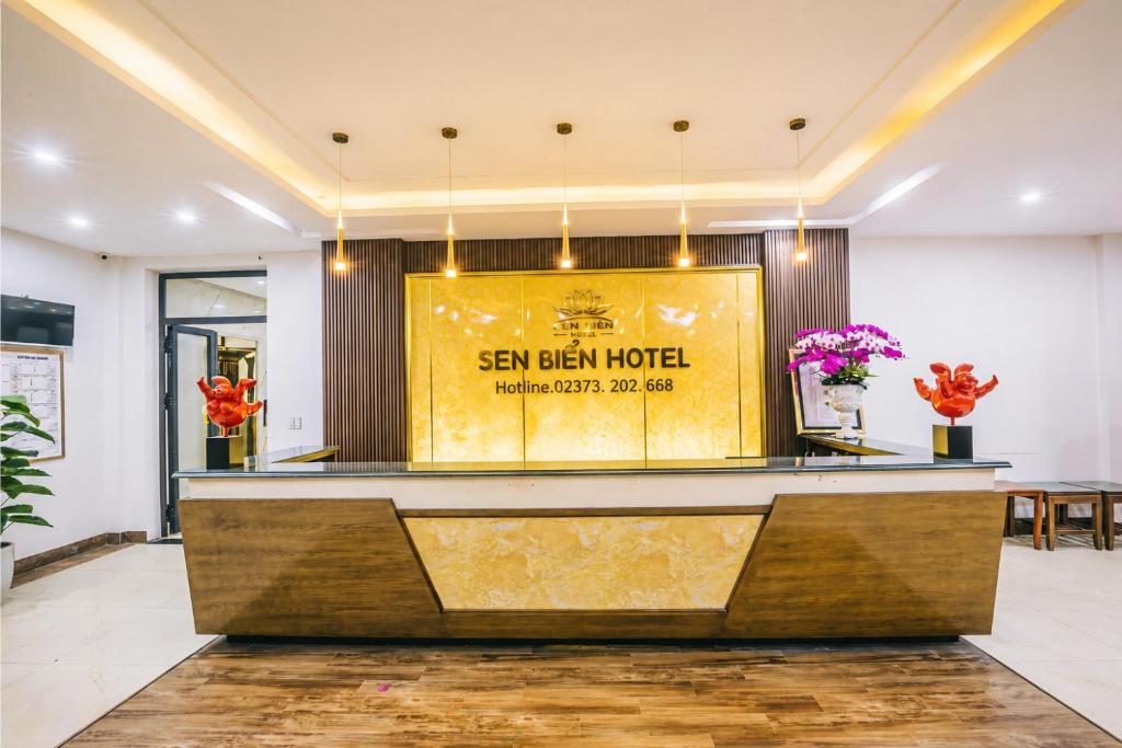 a hotel lobby with a sign that reads sen balai hotel at Khách Sạn Sen Biển - FLC Sầm Sơn in Sầm Sơn