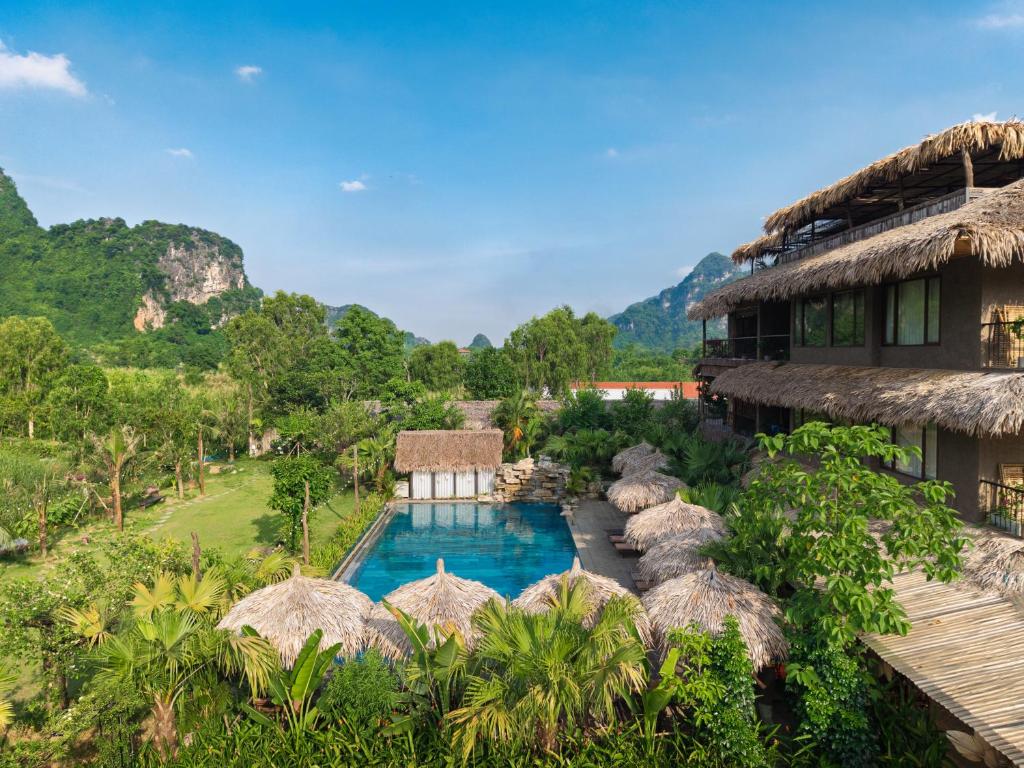an aerial view of a resort with a swimming pool at Tam Coc Oasis Resort & Spa in Ninh Binh