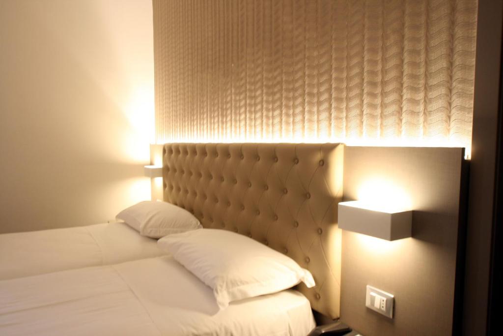 Postel nebo postele na pokoji v ubytování Hotel Principe
