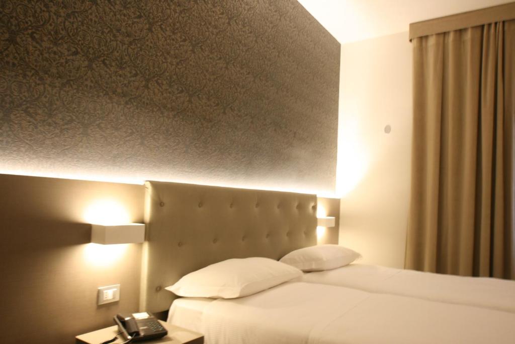 Postel nebo postele na pokoji v ubytování Hotel Principe