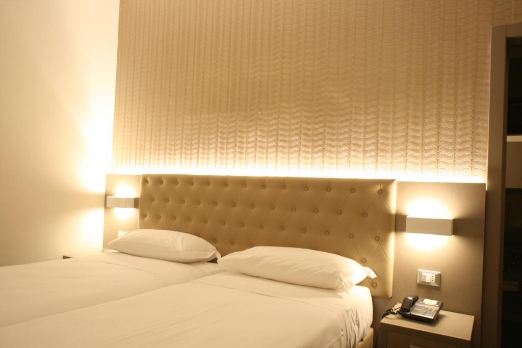 Postel nebo postele na pokoji v ubytování Hotel Principe